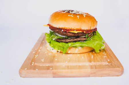 fresh tasty burger and french fries isolated on whiteの写真素材