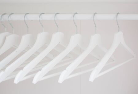 composition with white wooden hangers in the closetの写真素材