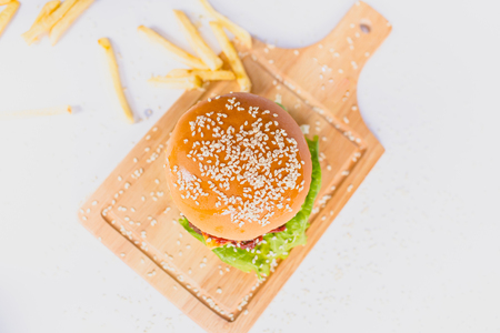 fresh tasty burger and french fries isolated on whiteの写真素材