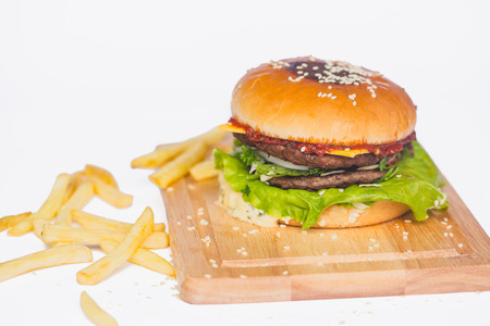 fresh tasty burger and french fries isolated on whiteの写真素材