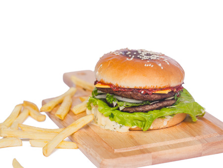 fresh tasty burger and french fries isolated on whiteの写真素材