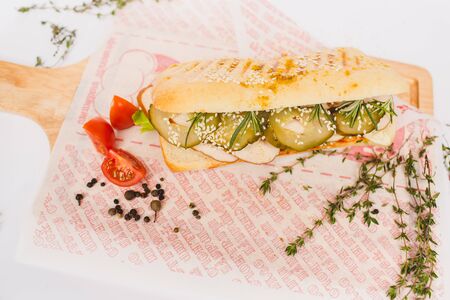 Long Ciabatta Sandwich with lettuce, slices of fresh tomatoes, cucumberの写真素材