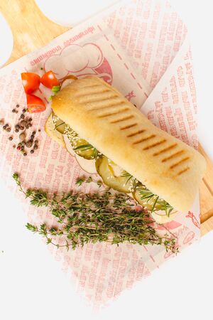 Long Ciabatta Sandwich with lettuce, slices of fresh tomatoes, cucumberの写真素材