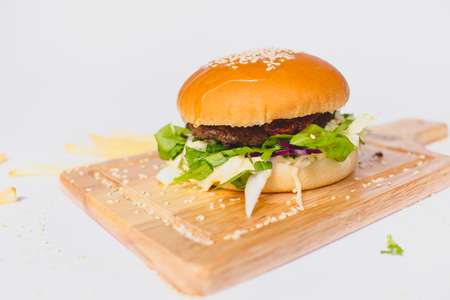 fresh tasty burger and french fries isolated on whiteの写真素材