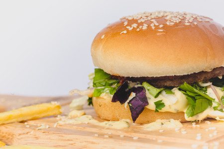 fresh tasty burger and french fries isolated on whiteの写真素材