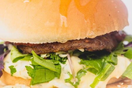 fresh tasty burger and french fries isolated on whiteの写真素材