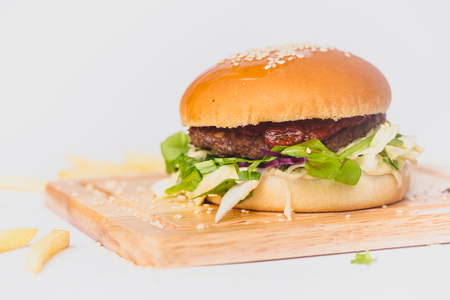 fresh tasty burger and french fries isolated on whiteの写真素材
