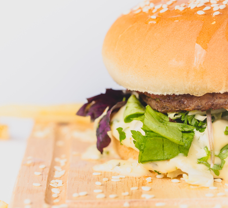 fresh tasty burger and french fries isolated on whiteの写真素材