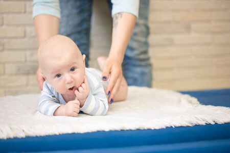 Portrait of happy young mother and baby at homeの写真素材