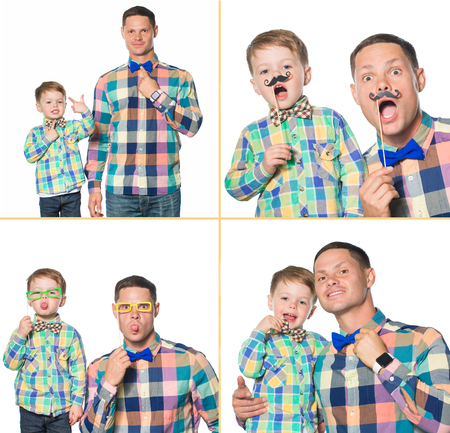 Happy father and son playing in studio isolated on whiteの写真素材