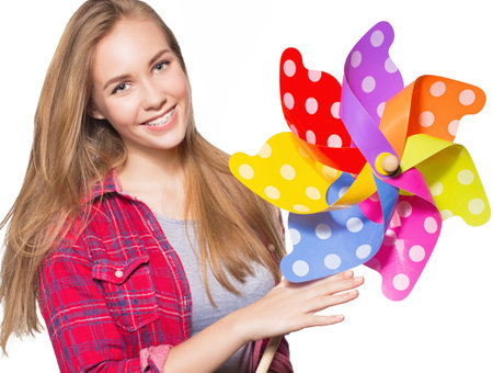 Close up portrait of smiling teen girl showing dental braces. Isolated on white background.の写真素材
