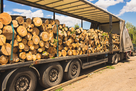 A log truck delivers its load in Bulgariaの写真素材