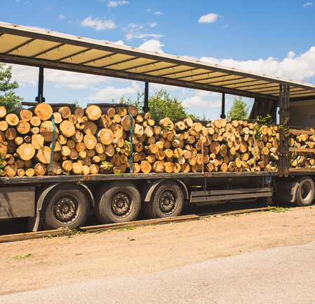 A log truck delivers its load in Bulgariaの写真素材