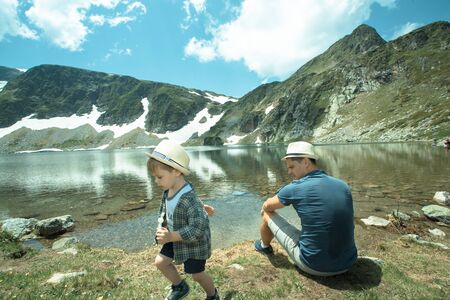 Father and his son near the Seven lakes in Rila mountain, Bulgariaの写真素材