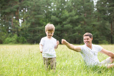 Father and son relationship, playing in the Parkの写真素材