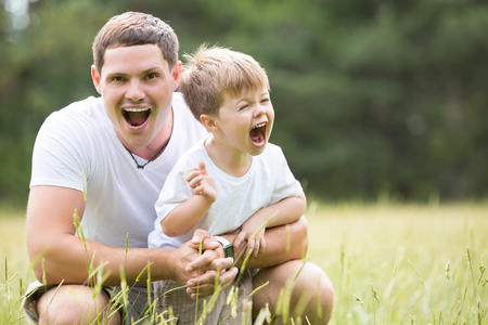 Father and son relationship, playing in the Parkの写真素材