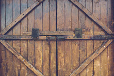 An old wood door with metal handle. Background photoの写真素材