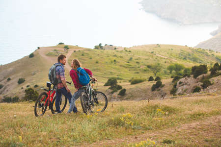 family concept. happy family  riding bikes at the mountainの写真素材