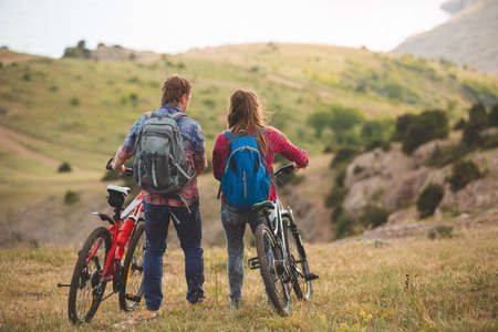 family concept. happy family  riding bikes at the mountainの写真素材