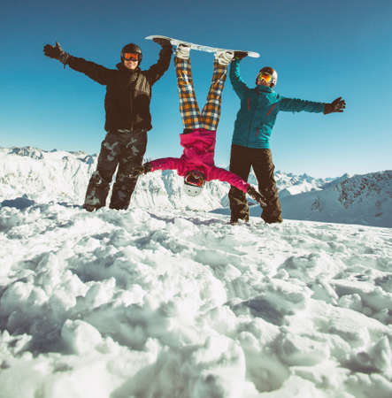 Group friends snowboarders have fun on the slopeの写真素材
