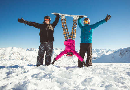 Group friends snowboarders have fun on the slopeの写真素材
