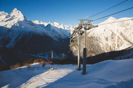 Ski lift construstion in caucasian mountains Dombayの写真素材