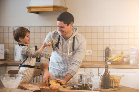 A father and his son cooking