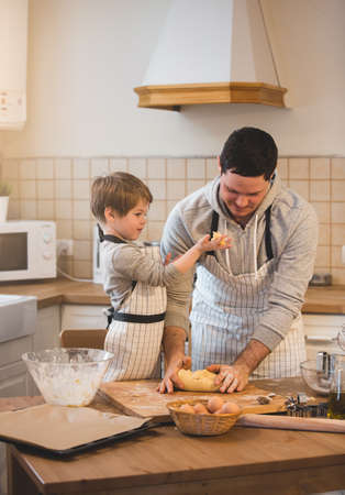A father and his son cookingの写真素材