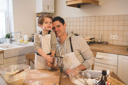 A father and his son cookingの写真素材