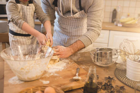 A father and his son cookingの写真素材