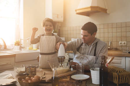 A father and his son cooking