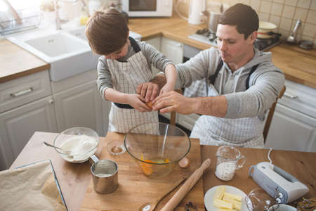 A father and his son cooking