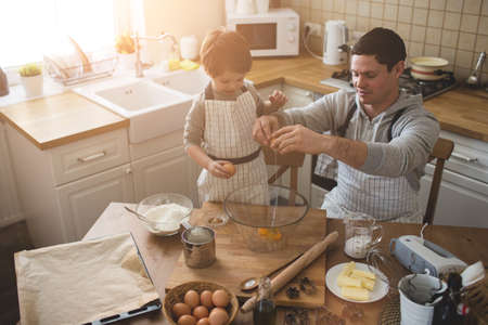 A father and his son cooking