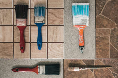 Multicolored brushes on a stone floor. Top viewの写真素材