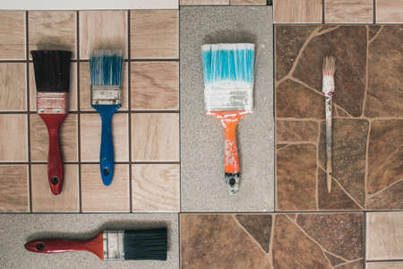 Multicolored brushes on a stone floor. Top viewの写真素材