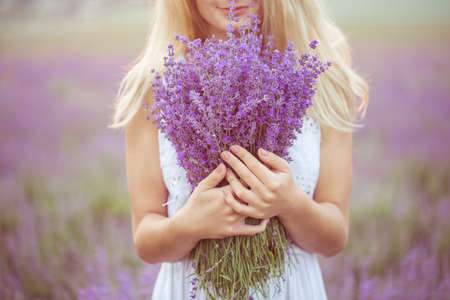 Beautiful girl on the lavender fieldの写真素材
