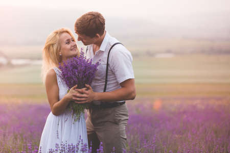 Beautiful couple on the lavender fieldの写真素材