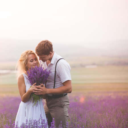 Beautiful couple on the lavender fieldの写真素材