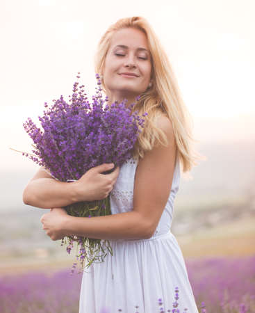 Beautiful girl on the lavender fieldの写真素材