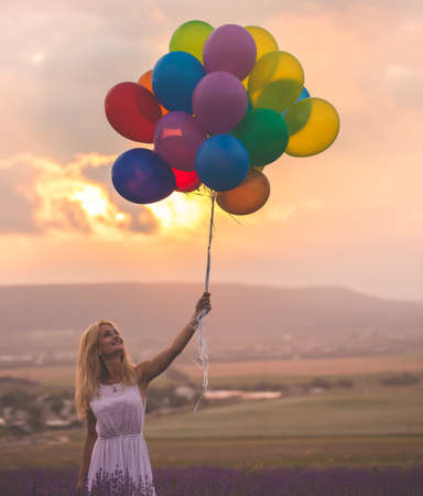 Beautiful woman on the lavender fieldの写真素材
