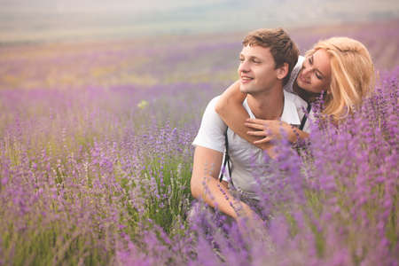Beautiful couple on the lavender fieldの写真素材