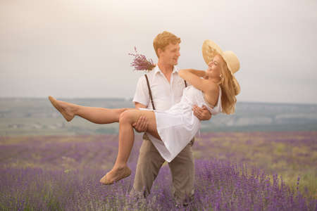 Beautiful couple on the lavender fieldの写真素材