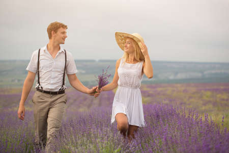 Beautiful couple on the lavender fieldの写真素材