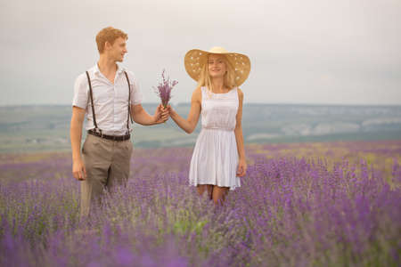 Beautiful couple on the lavender fieldの写真素材