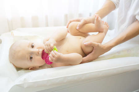 Portrait of young beautiful mother with baby sonの写真素材