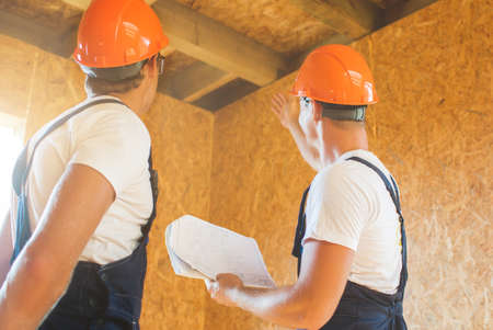 Two man building wooden houseの写真素材