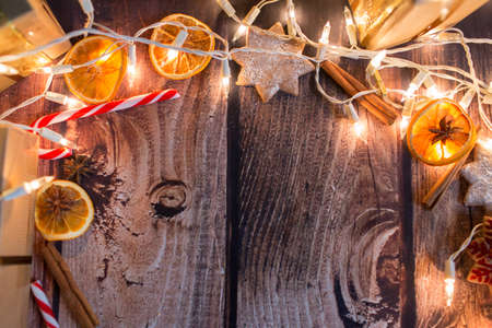 Christmas frame with lights, ornaments, candy and decorations. Free spaceの写真素材