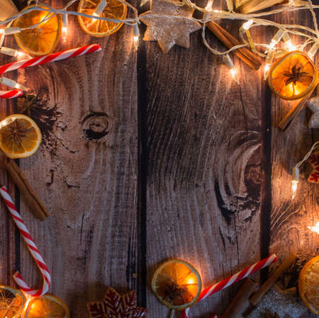 Christmas frame with lights, ornaments, candy and decorations. Free spaceの写真素材