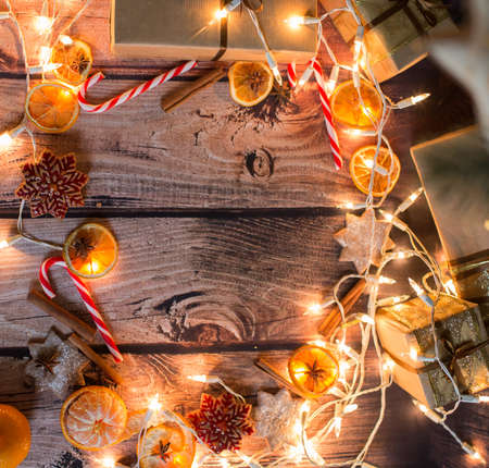 Christmas frame with lights, ornaments, candy and decorations. Free spaceの写真素材