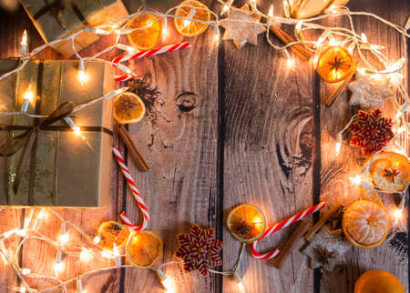 Christmas frame with lights, ornaments, candy and decorations. Free spaceの写真素材